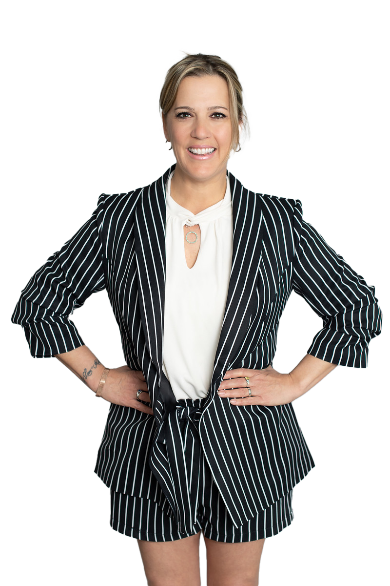 Sylvie Bergeron for Vie for Life coaching, picture standing with striped suit and white blouse. Hands on her hip with a smile ready for her new business